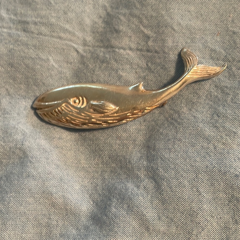 Silver plated whale pin.